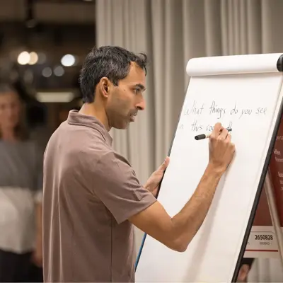 Suraj Bramhavar writing on a whiteboard