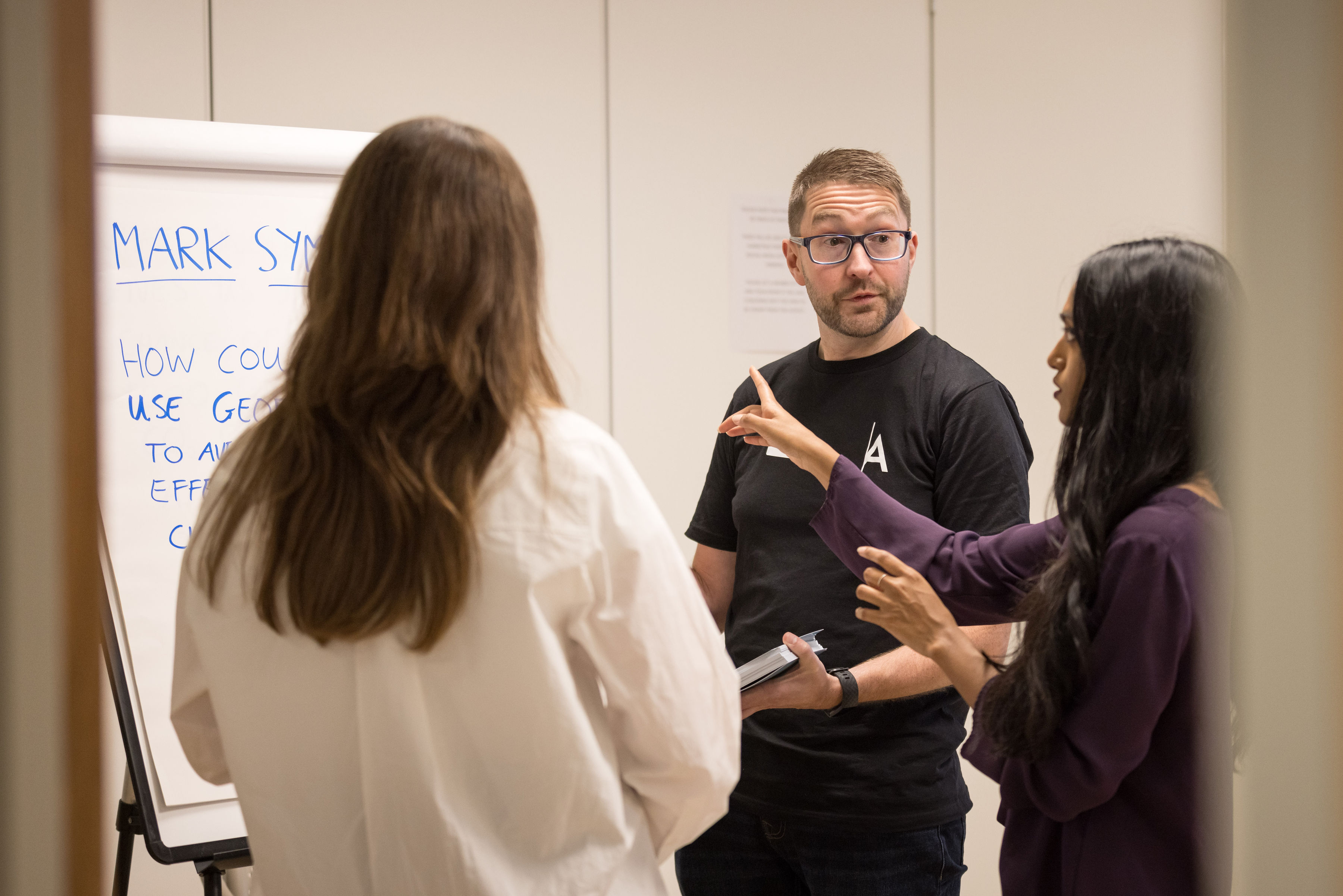 A photo of Mark Symes in conversation.