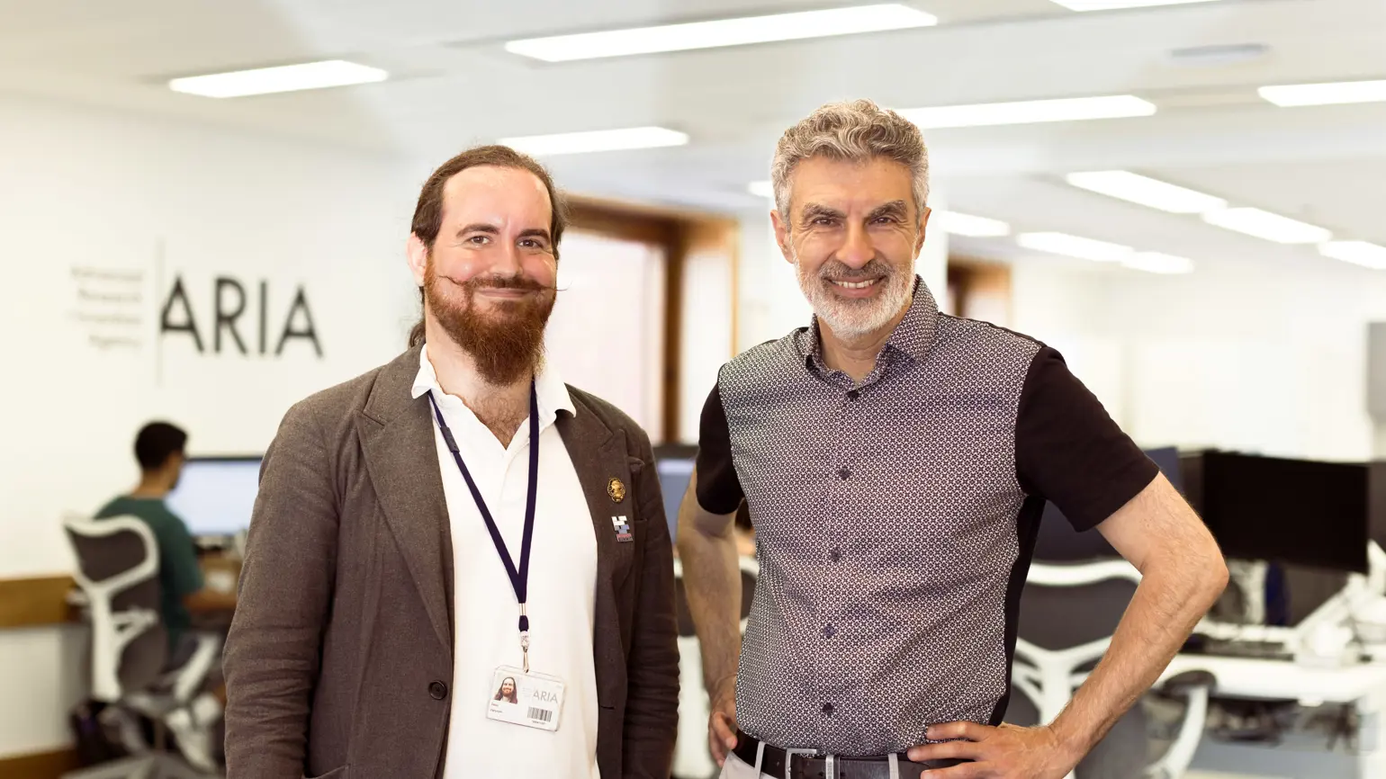 A photo of Yoshua Bengio and David 'davidad' Dalyrmple smiling for the camera.