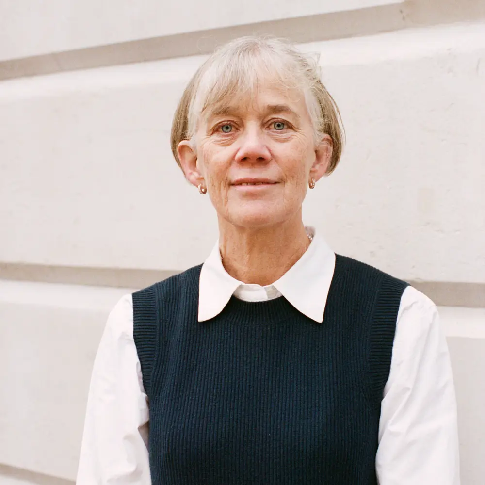 Headshot of Dame Angela McLean standing outside a building