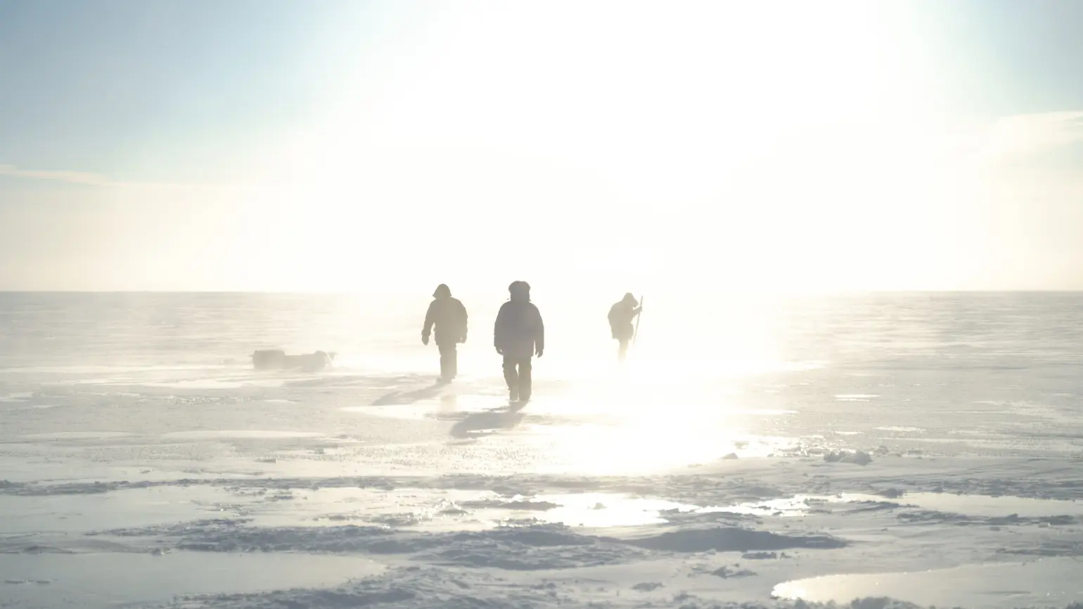 Real Ice team working on a pump in the ice fields” width=