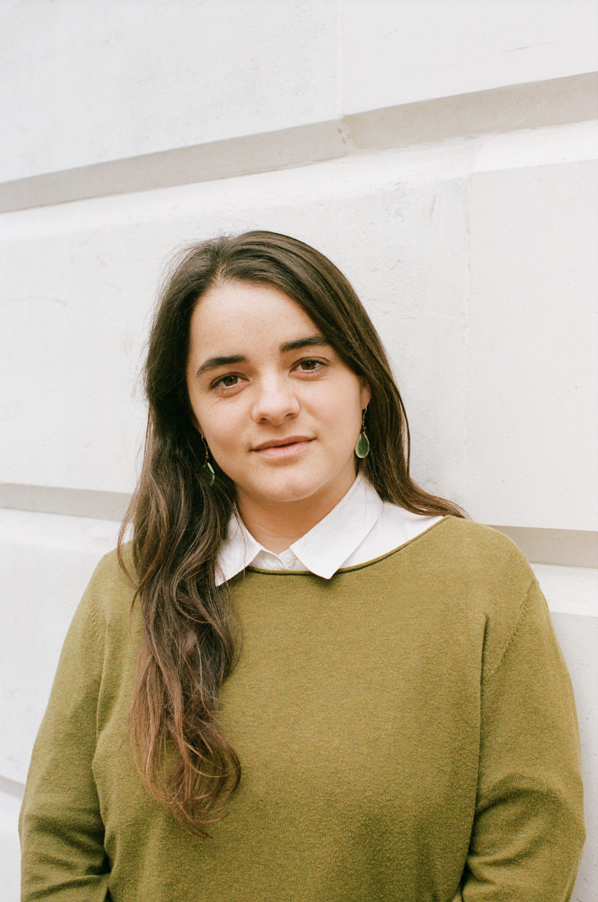 A photo of Nora Ammann smiling at the camera against a white background.